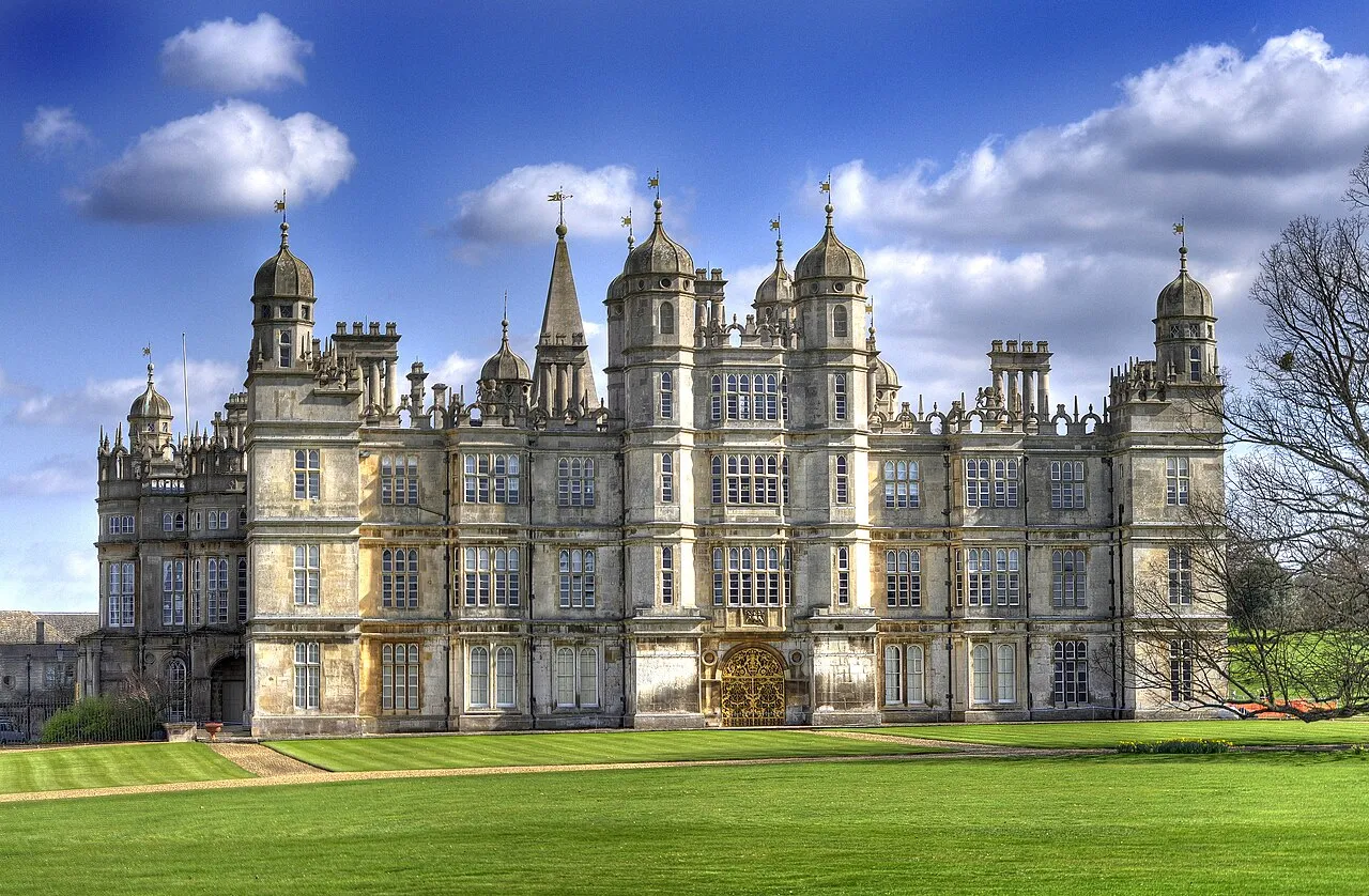 Burghley House’s towers and ornamented facade above a broad lawn