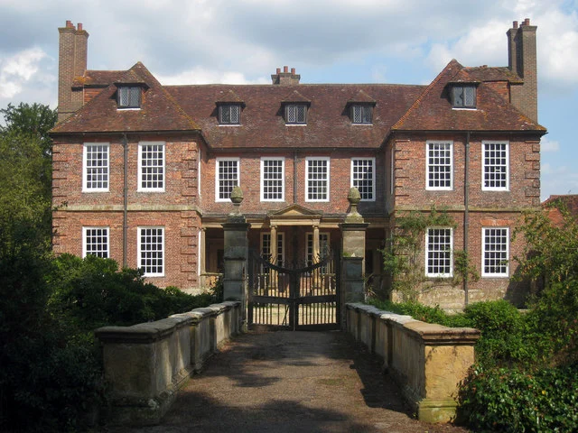 Groombridge Place beyond its moat and gated bridge