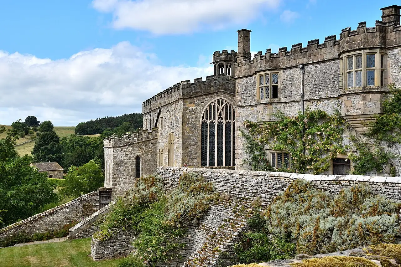 Haddon Hall’s battlemented stone walls above its terraced garden