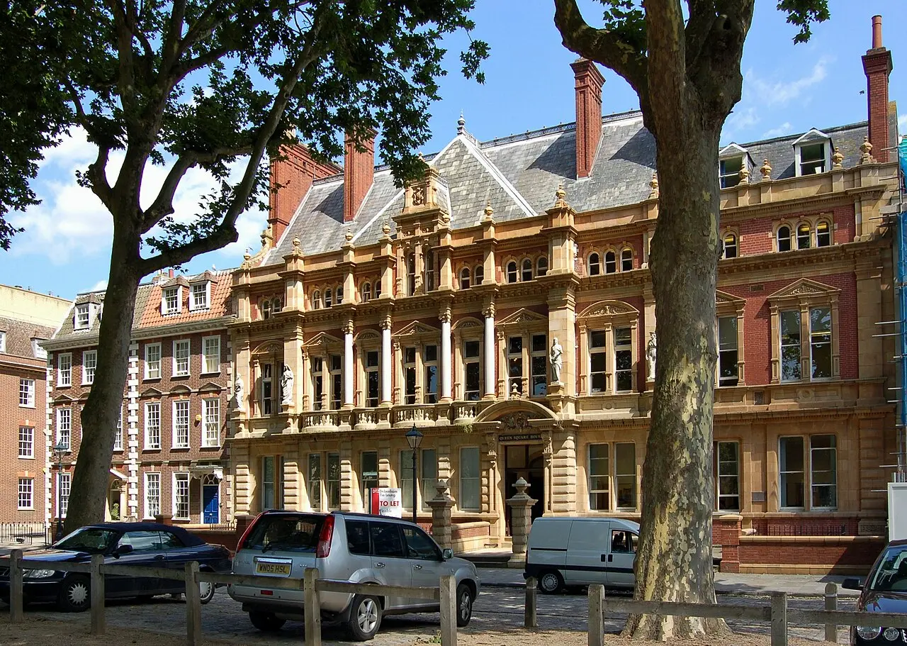 Historic buildings and trees beside Queen Square in Bristol