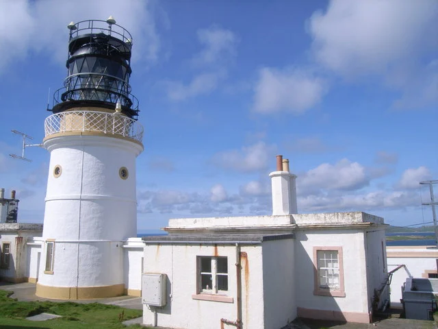 The white tower and buildings of Sumburgh Head lighthouse