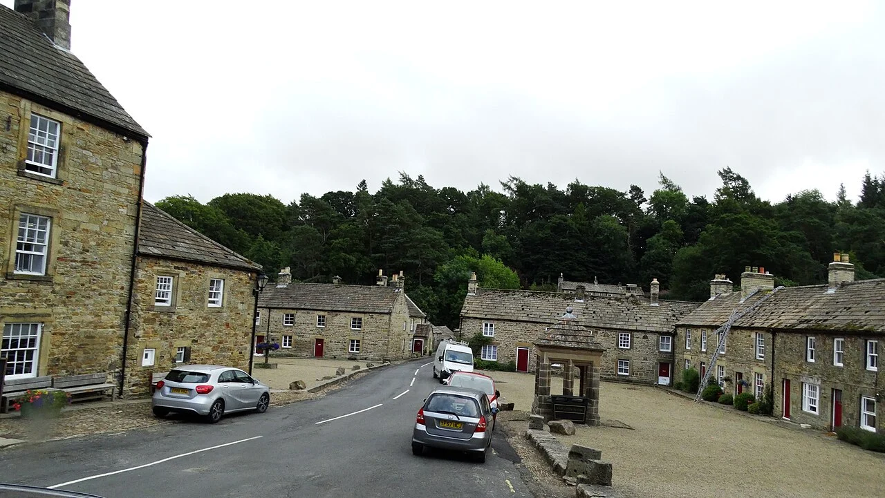 Stone buildings enclosing the village square at Blanchland