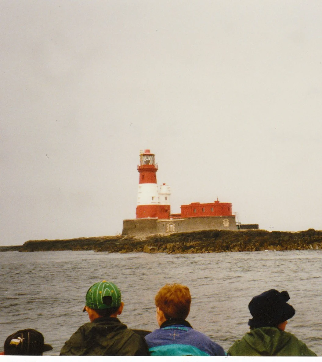 Longstone lighthouse in the Farne Islands seen from a visitor boat