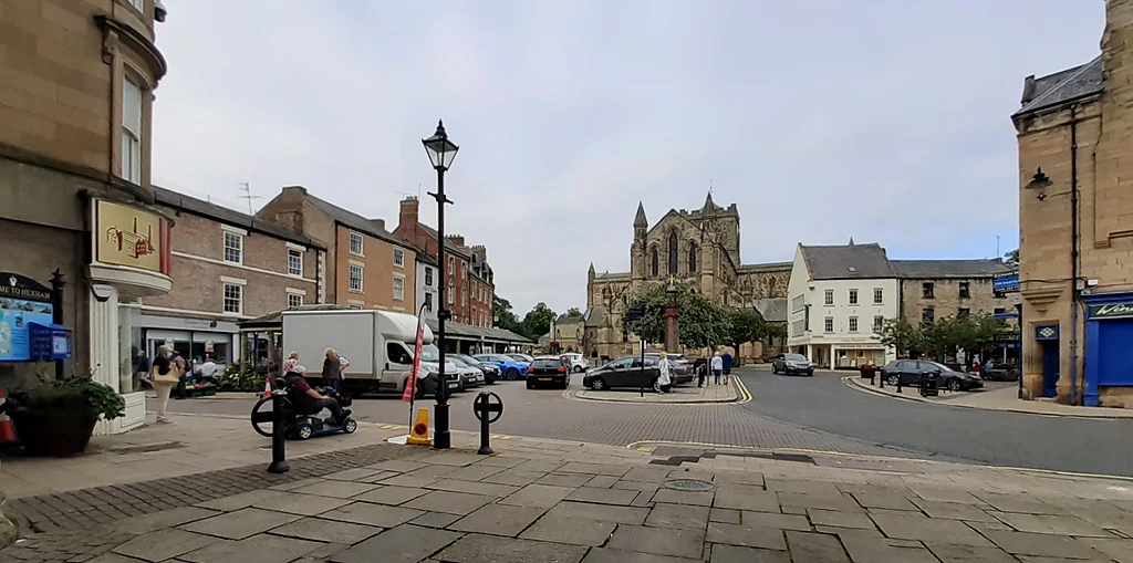 Hexham Market Place with the abbey behind the town buildings