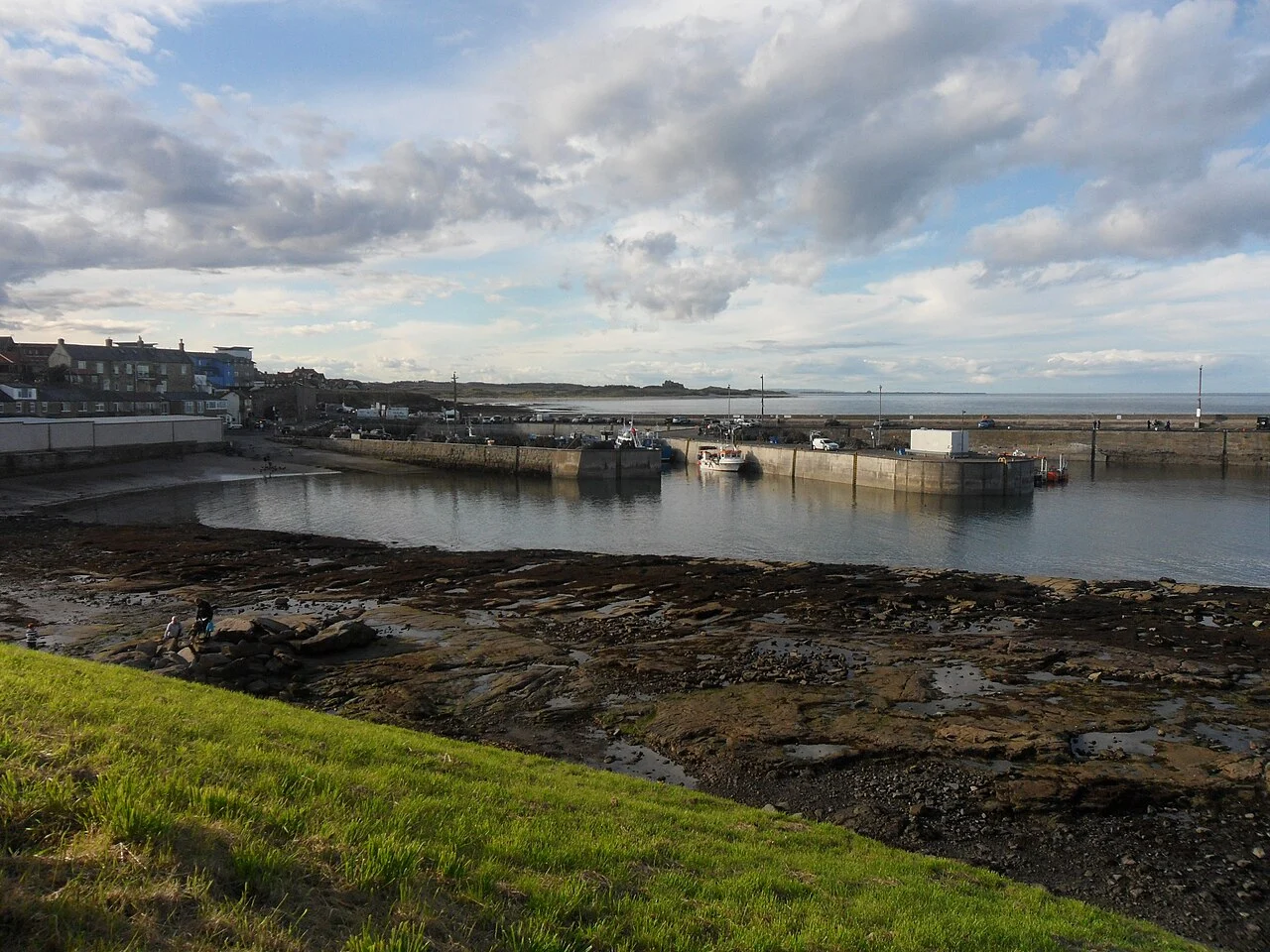 Boats and harbour walls at North Sunderland Harbour in Seahouses