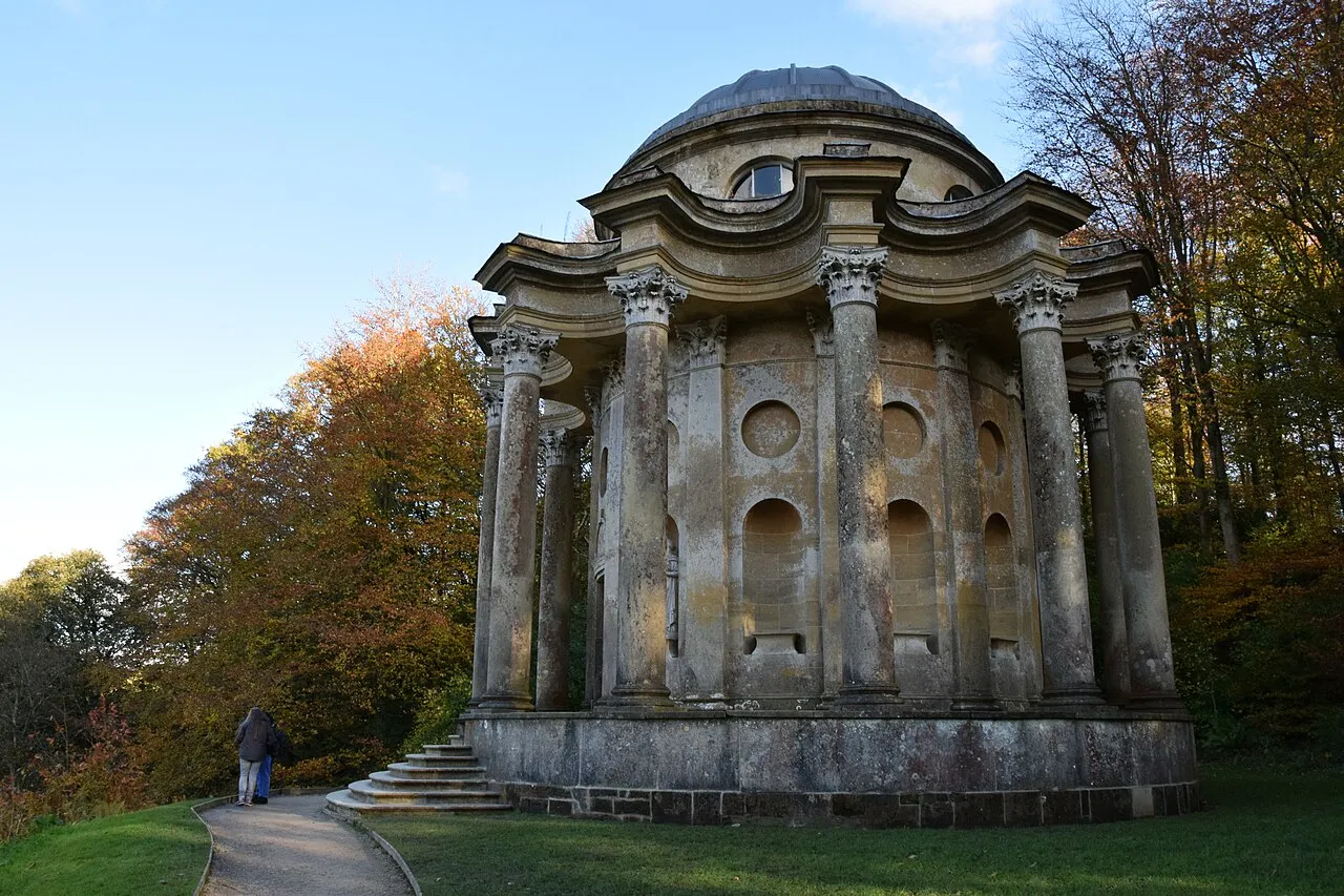 The Temple of Apollo at Stourhead beside autumn trees